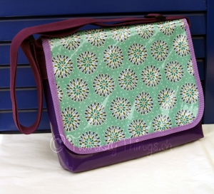 Another non-detachable flap bag, this time with a purple base.